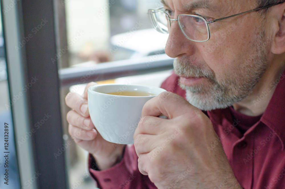 aged man with a cup of tea aged man with a cup of tea