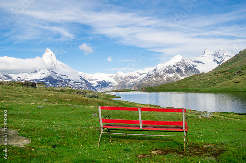 The beautiful mountain Matterhorn landscape with Stellisee lake and lonely bench, Switzerland