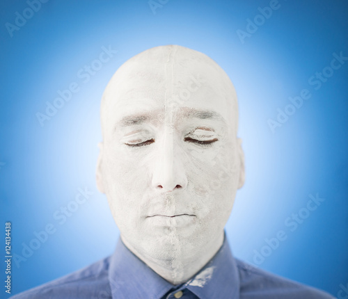 Artistic painting man face in white