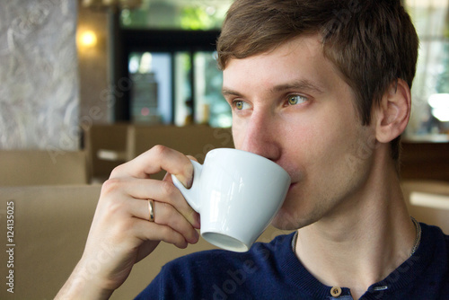  young man drinking cofee