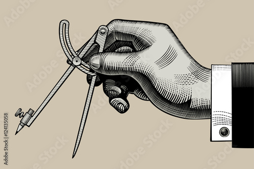 Hand with a compass for drawing