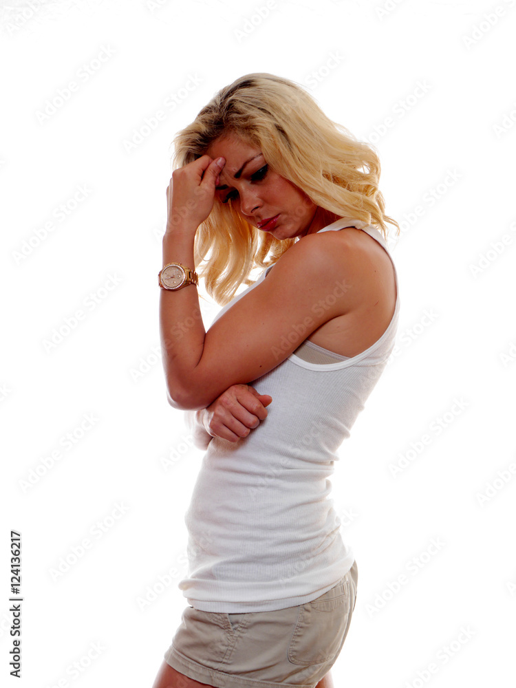 A blond haired woman is deep into thought. A blond haired woman is deep into thought.