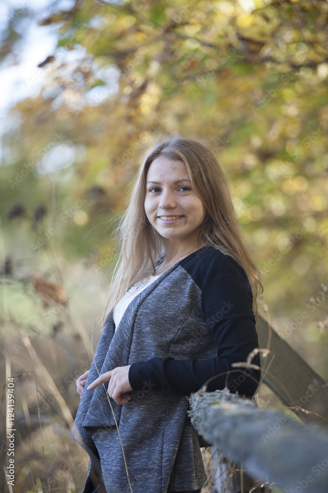Girl with a cute smile on sunny autumn day Girl with a cute smile on sunny autumn day