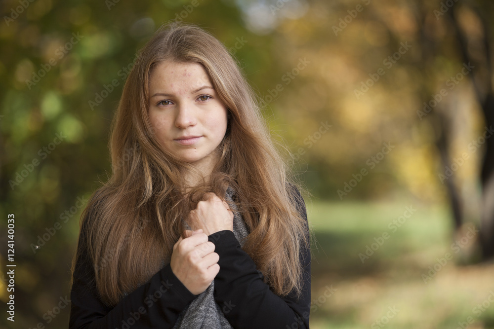 Girl with a cute smile on sunny autumn day Girl with a cute smile on sunny autumn day