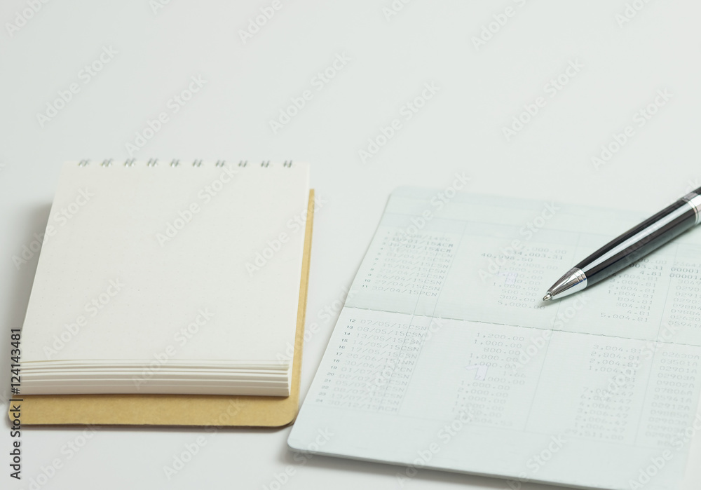 Saving account pass book with credit card, ball pen for financia Saving account pass book with credit card, ball pen for financia