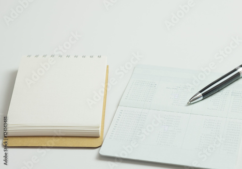 Saving account pass book with credit card, ball pen for financia