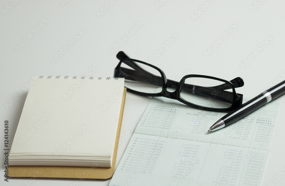 Saving account pass book with credit card, ball pen for financia Saving account pass book with credit card, ball pen for financia