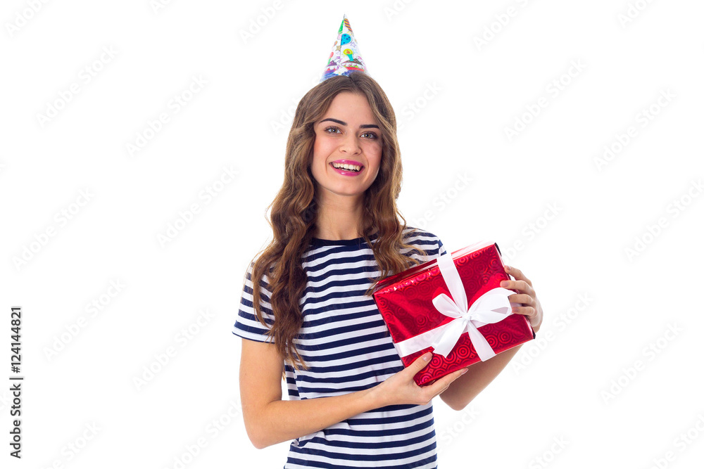 Woman in celebration cap holding a present Woman in celebration cap holding a present