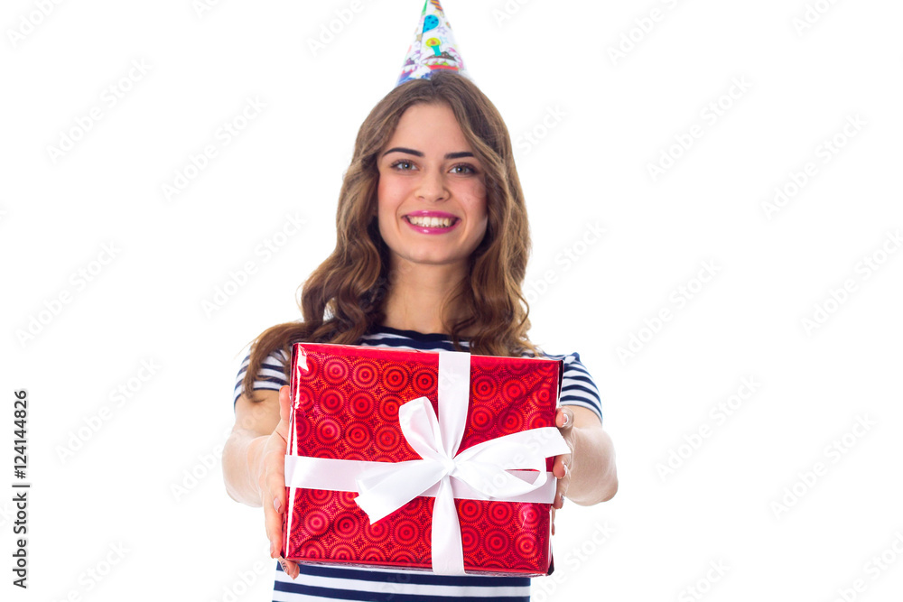 Woman in celebration cap holding a present Woman in celebration cap holding a present