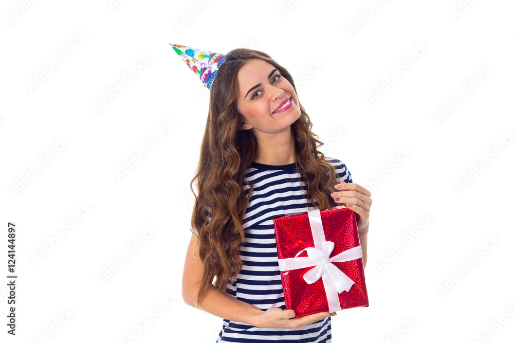 Woman in celebration cap holding a present Woman in celebration cap holding a present