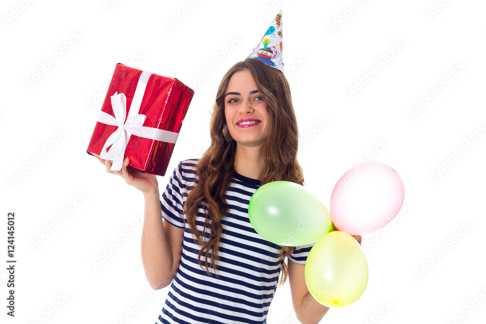 Woman holding present and balloons Woman holding present and balloons