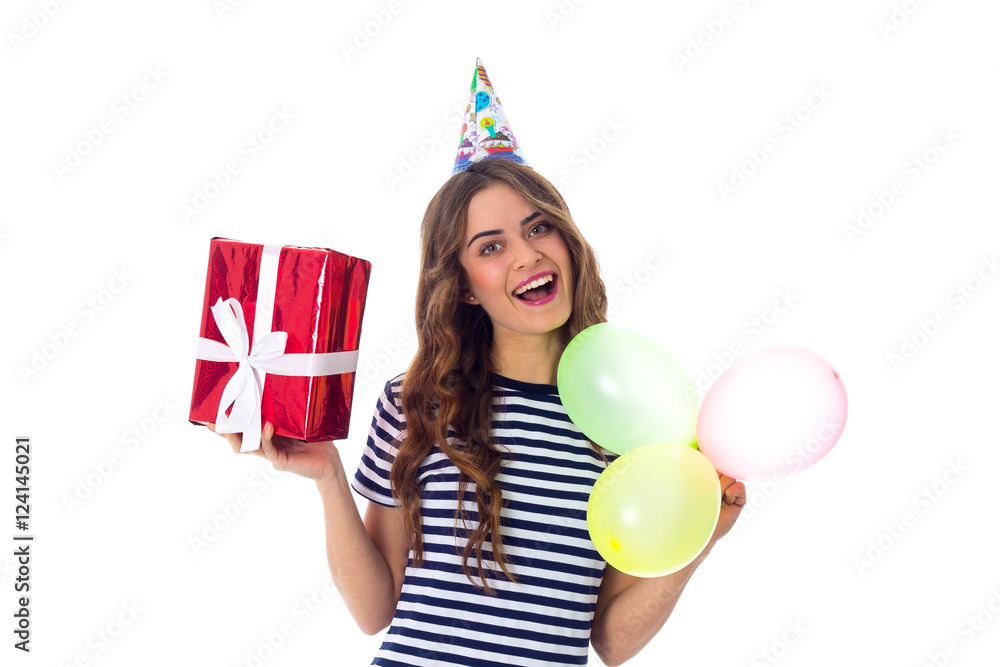 Woman holding present and balloons Woman holding present and balloons