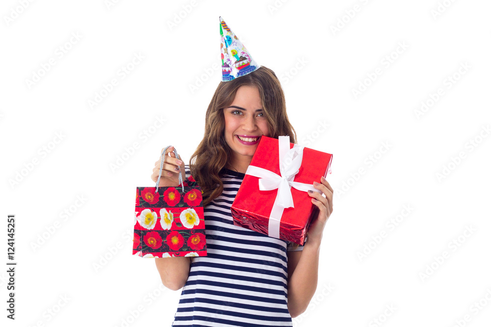 Woman in celebration cap holding presents Woman in celebration cap holding presents