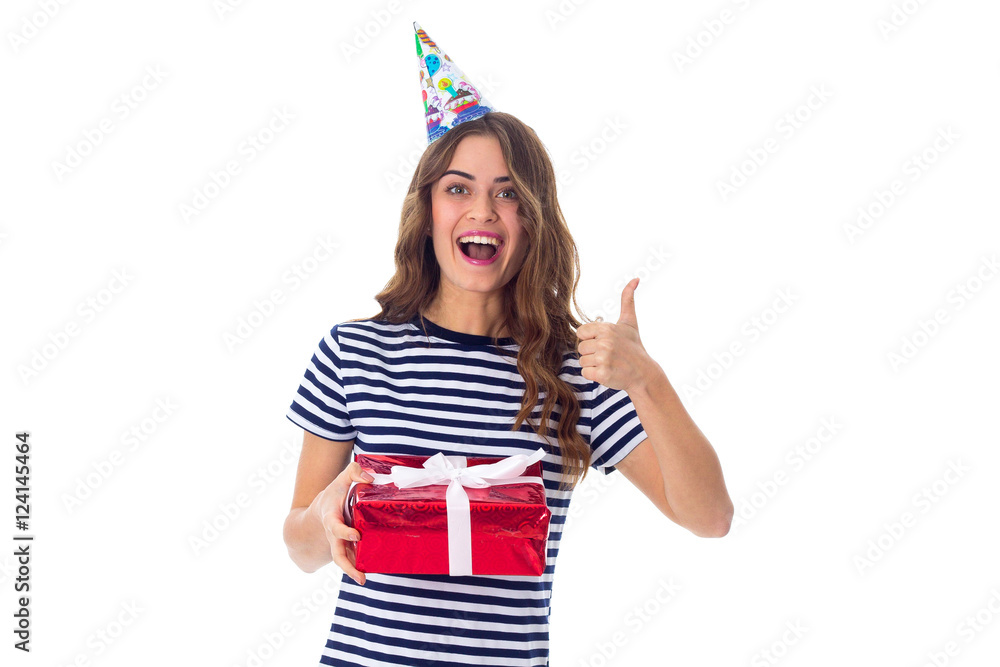 Woman in celebration cap holding a present Woman in celebration cap holding a present