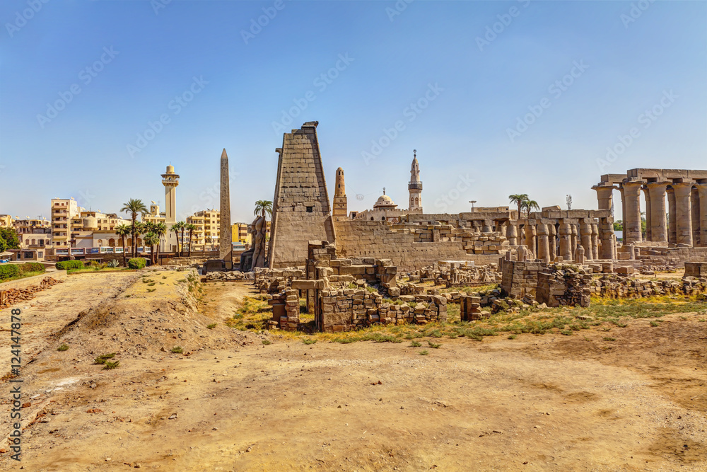 The famous Amenhotep colonnade of the Luxor temple next to the Abu Haggag mosque, Egypt, HDR Image.