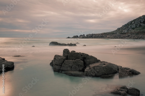 Long exposure shot of rocky beach in Cornwall, England