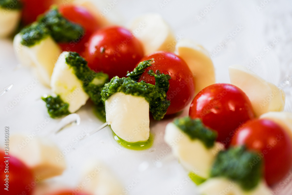 close up of mozzarella and cherry tomato canape close up of mozzarella and cherry tomato canape