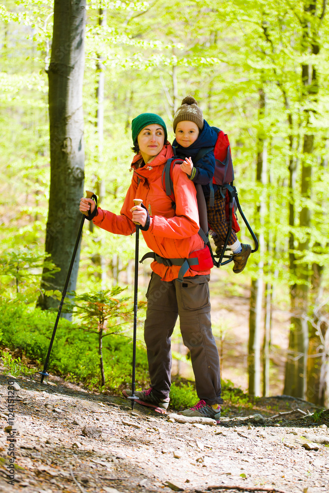 The mother and son are traveling. The mother and son are traveling.
