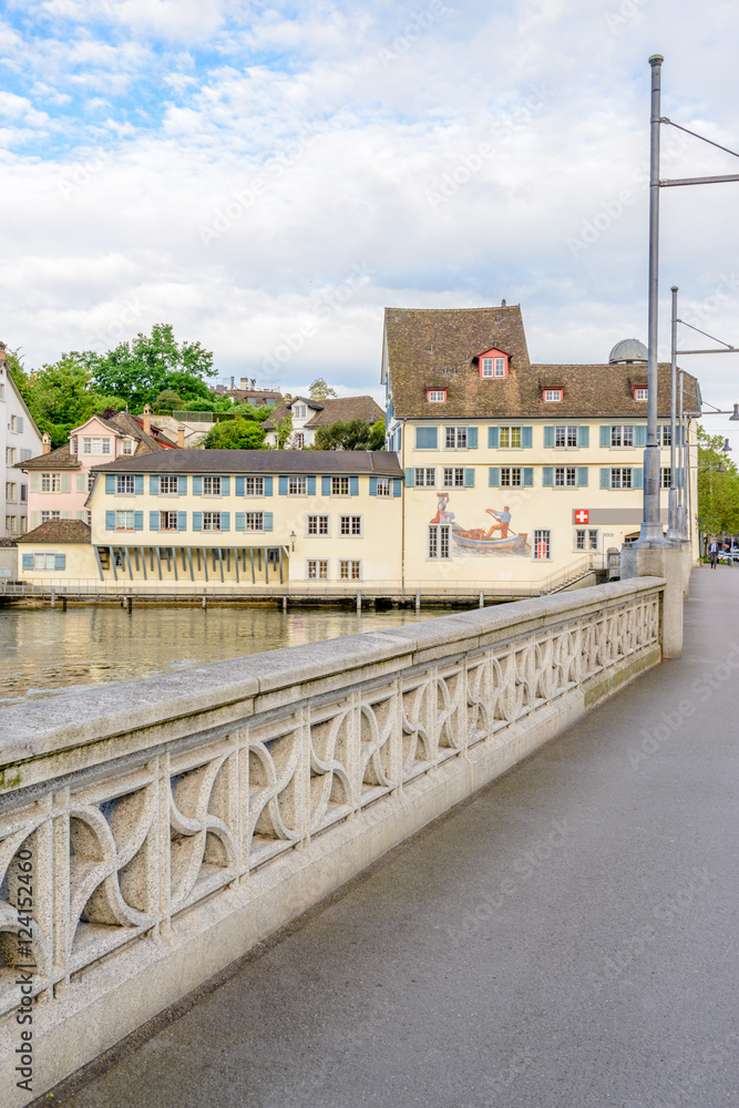 Beautiful view of historic city center of Zurich with river Limmat on a sunny day with blue sky and clouds in summer, Canton of Zurich, Switzerland.