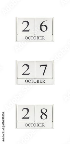 Closeup group of white wooden calendar with black 26 , 27 , 28 october word , three date calendar isolated on white background