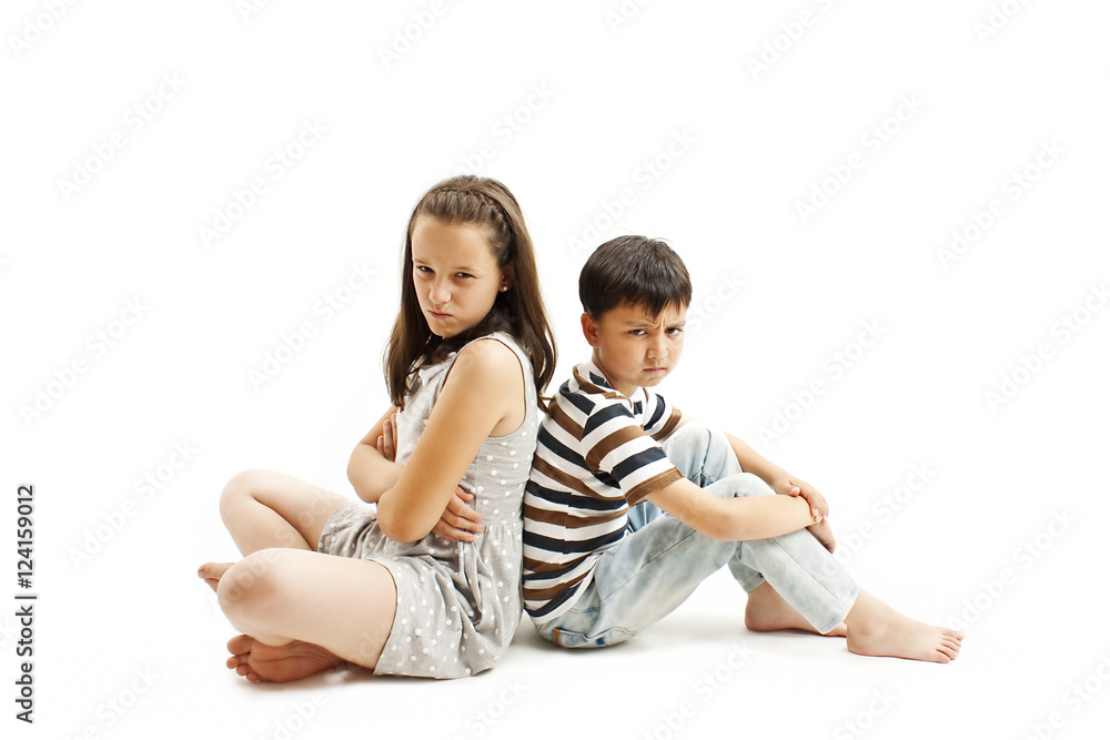 Upset brother and sister together. Isolated on white background
Upset brother and sister together. Isolated on white background