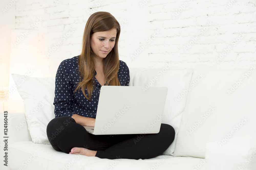 happy beautiful 30s woman using laptop computer smiling networking at home modern living room relaxed happy beautiful 30s woman using laptop computer smiling networking at home modern living room relaxed