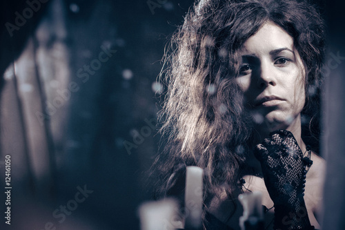 Lonely sad woman in a vintage dress. © SKfoto