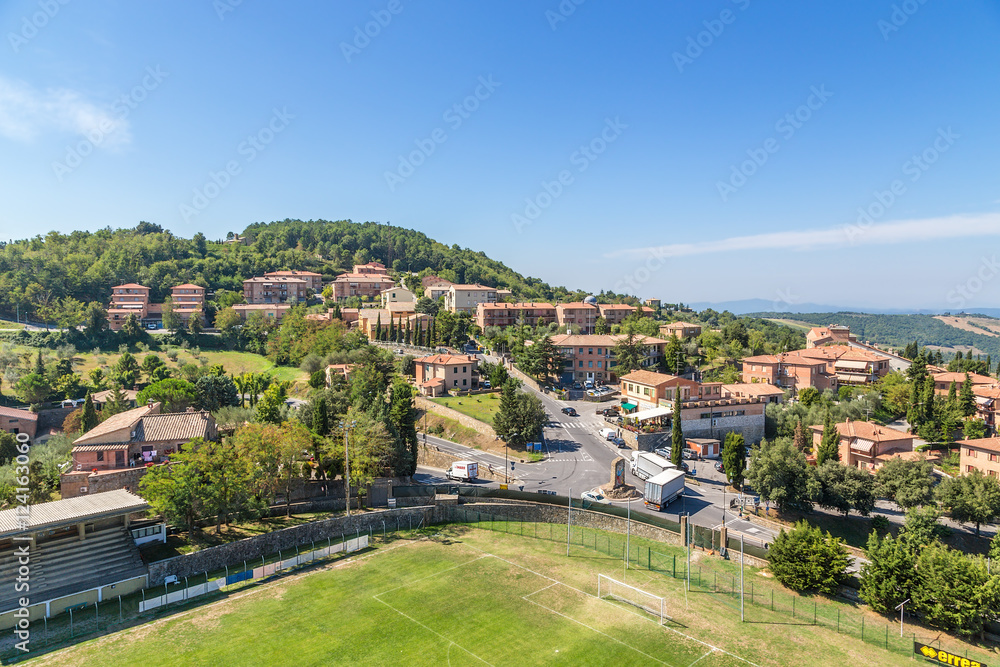 Montalcino, Italy. Typical landscape: mountains, tiled roofs, football