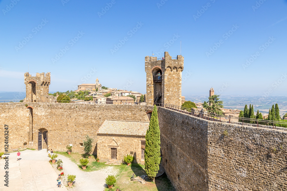 Montalcino, Italy. Castle courtyard (1361) and the city in the background