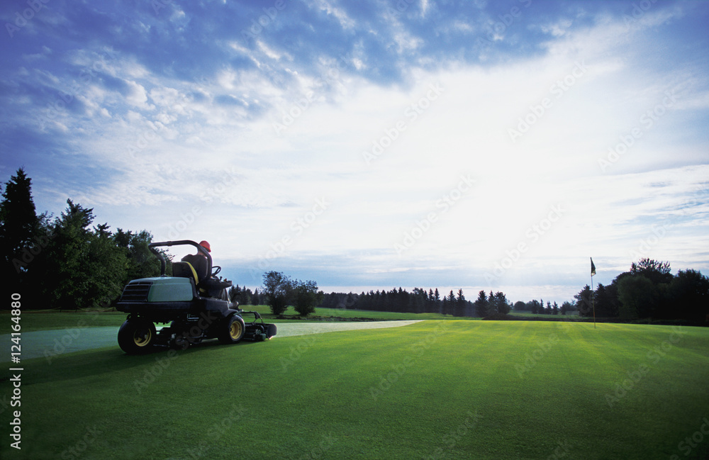 Greenskeeper Mowing Grass
