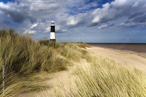 Lighthouse on beach, Humberside, England, UK photo