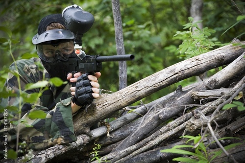 Male Aiming A Paintball Gun