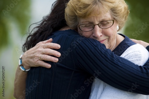 Mother And Daughter Embracing photo