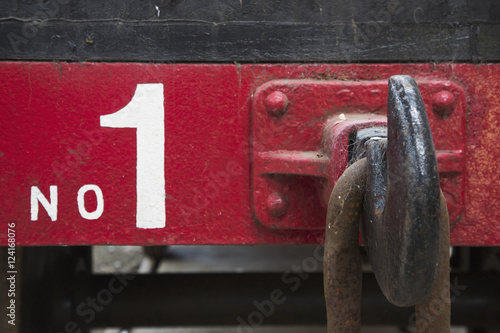 A large metal hook and chain link on the back of a train car labeled number one;Shildon durham england