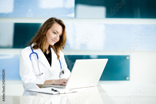 Young Woman Doctor Nurse in Hospital Clinic Office