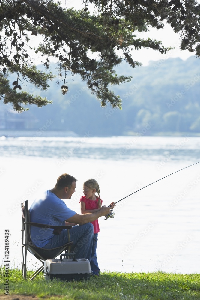 A Father And Daughter Fishing Together A Father And Daughter Fishing Together