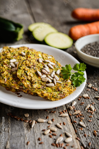 Baked vegetable pancakes with zucchini, carrot, chia, flax seeds and oatmeal
