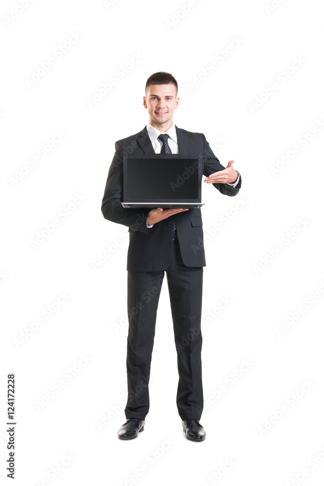 Young businessman wih a laptop isolated on white