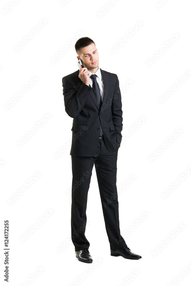 Young businessman with a smartphone on white Young businessman with a smartphone on white