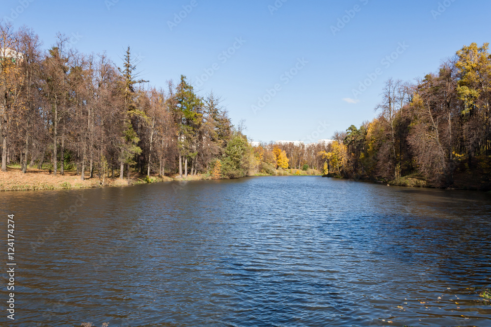 Landscape on a city pond in sunny autumn day
