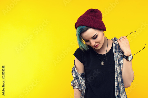 creative person style on yellow background. modern teenager. colour / colorful hairstyle