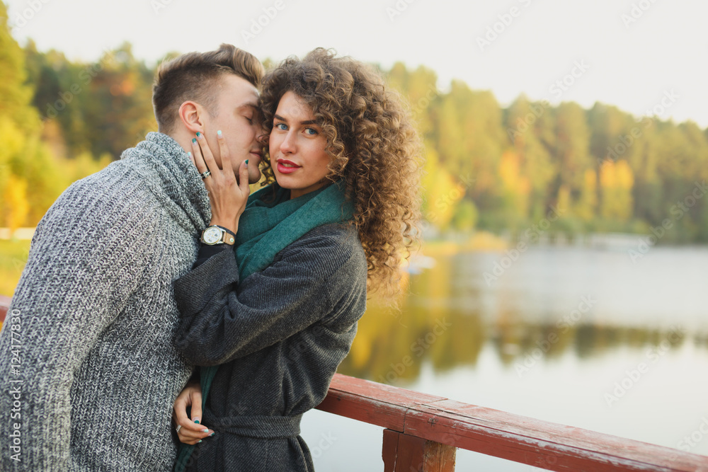 Fototapeta premium Romantic Couple sitting on the pier