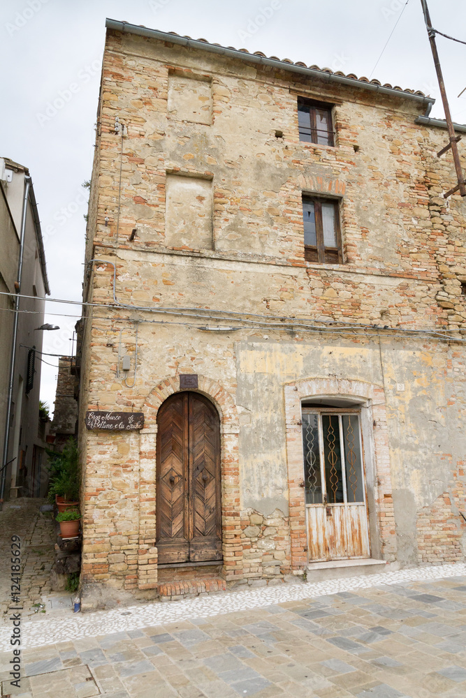 Old house in italy with a woden door