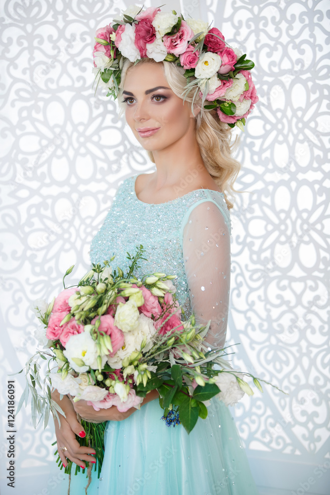 Gorgeous bride in wedding blue dress flowers wreath and bouqute Gorgeous bride in wedding blue dress flowers wreath and bouqute