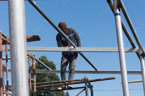 welder worker welding metal