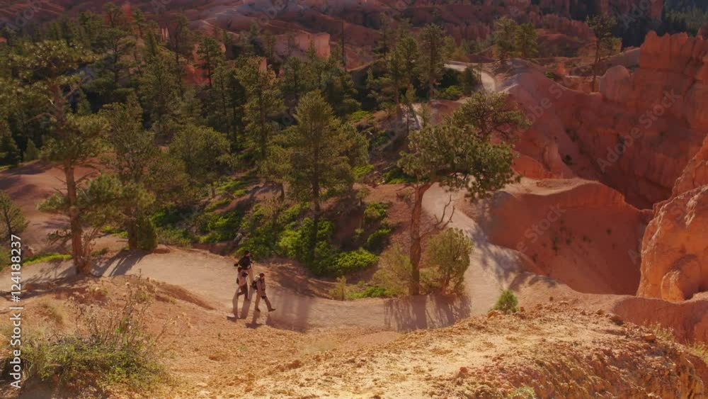 Wide shot of hikers hiking in Bryce Canyon National Park Wide shot of hikers hiking in Bryce Canyon National Park