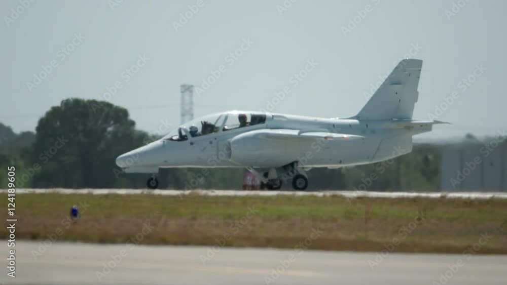 Slow motion of fighter jet moving on the runway Slow motion of fighter jet moving on the runway