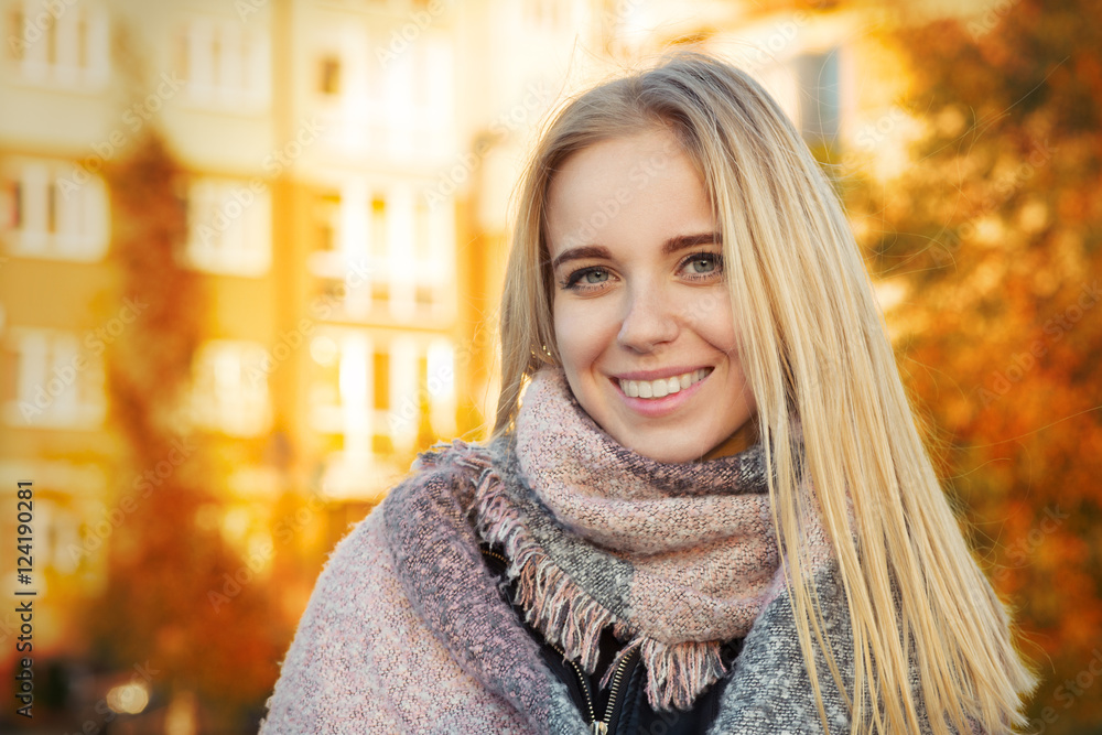 happy woman smiling in park at autumn sunset, toned image happy woman smiling in park at autumn sunset, toned image