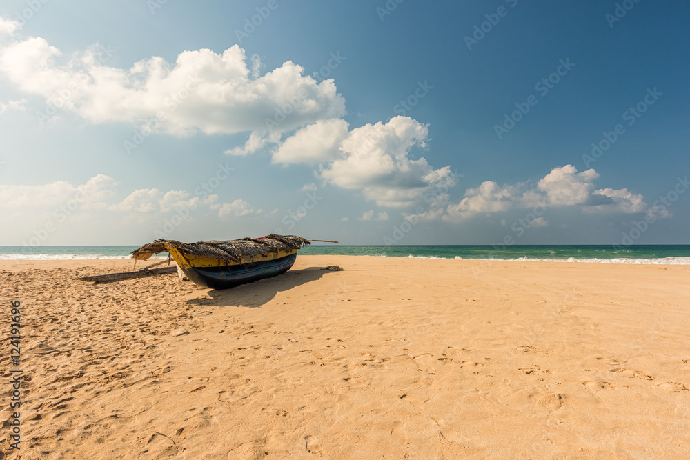 Tropical beach with boat in Sri lanka.