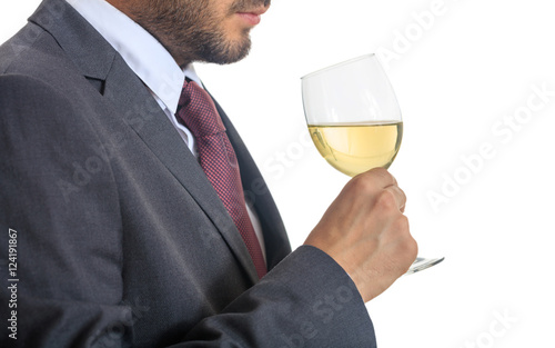 Man in suit drinking white wine